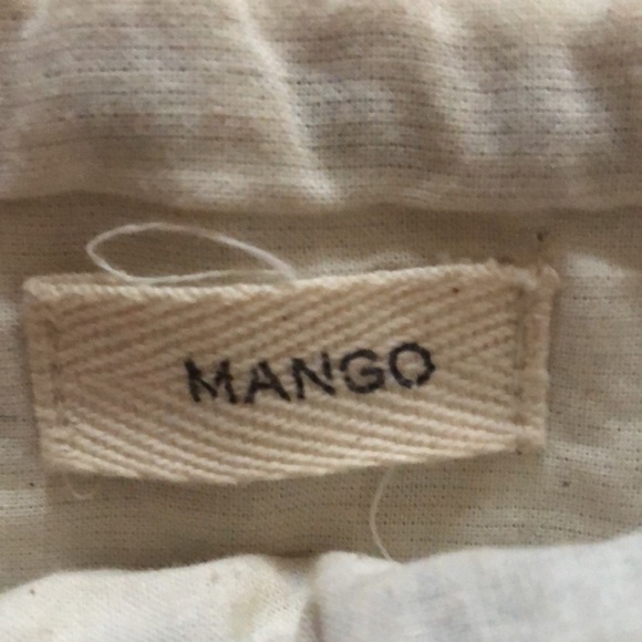 Mango clutch. Textured geometric pattern. Zip top w/ black grosgrain ribbon pull - Picture 8 of 11